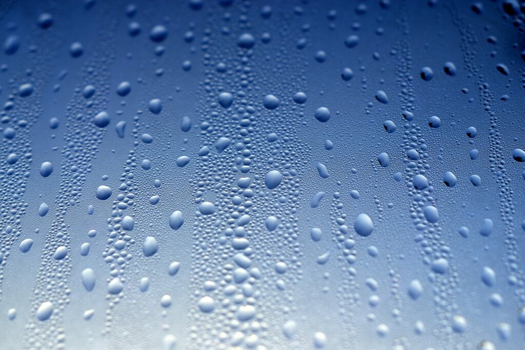 winter studio apartment window condensation close up