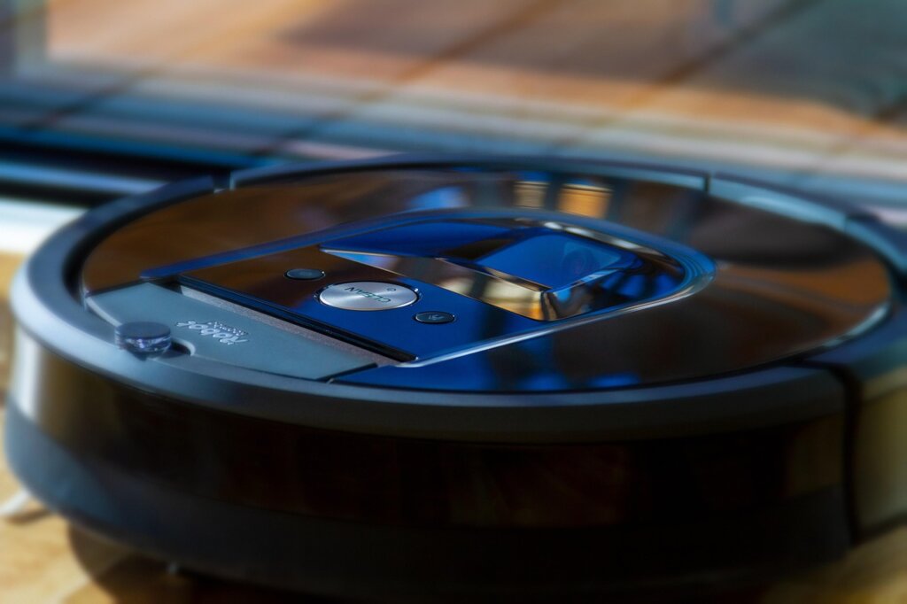 robot vacuum cleaner on clean hardwood floor