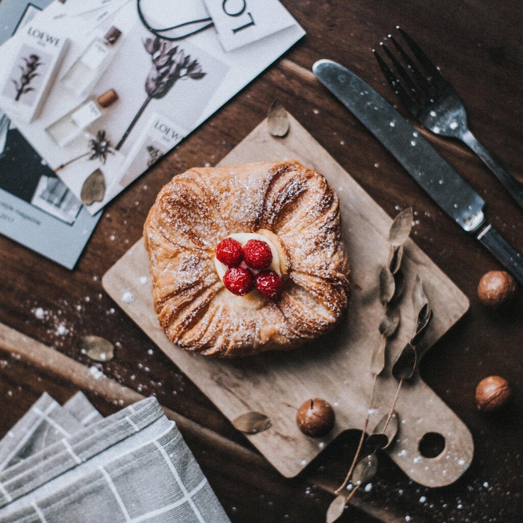 old damaged wooden cutting board with deep knife marks