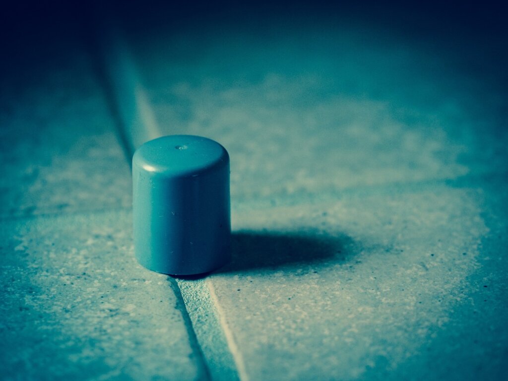 draft stopper placed at the bottom of an apartment door winter
