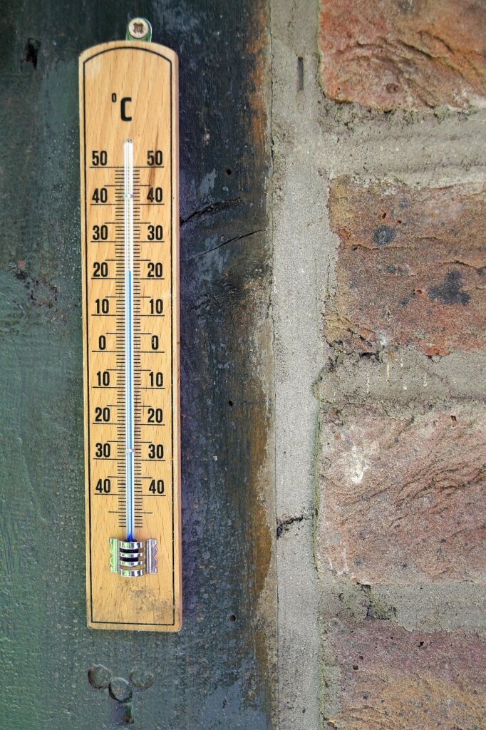 digital thermometer showing 26 degrees celsius in air-conditioned room