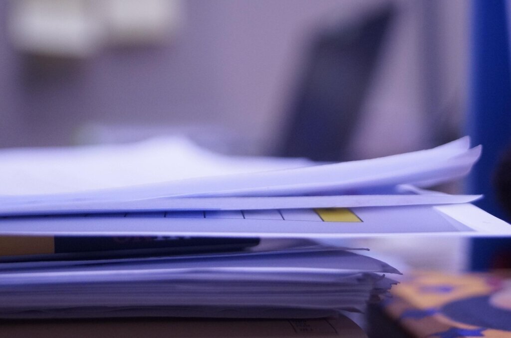 office worker suffering from headache near air conditioner